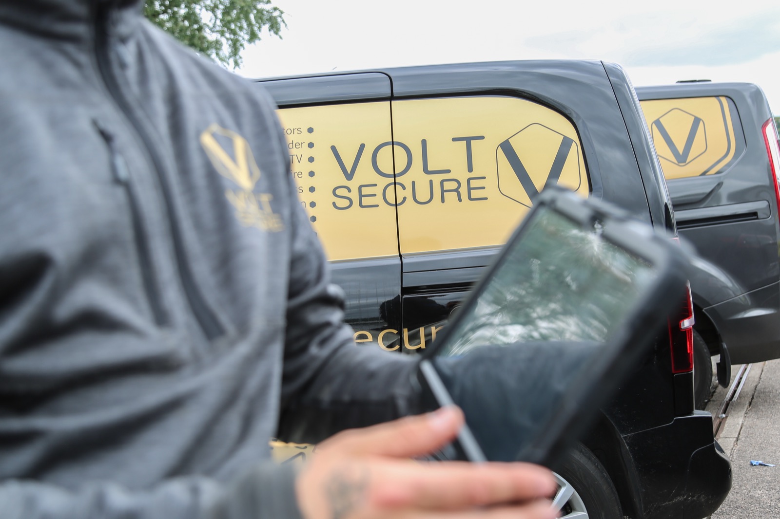 VoltSecure engineer running a multi-site CCTV health-check on tablet